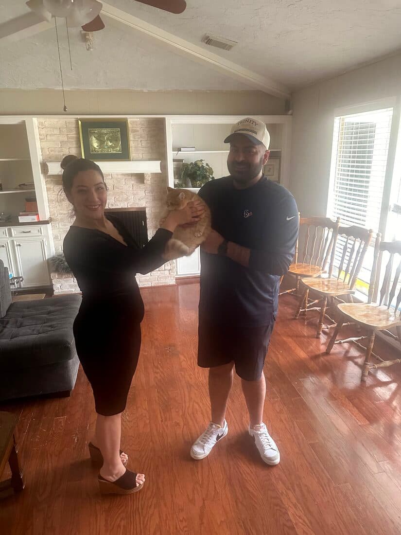 A family collecting their British Shorthair kitten from Houston Cat Mom Cattery in Houston, Texas