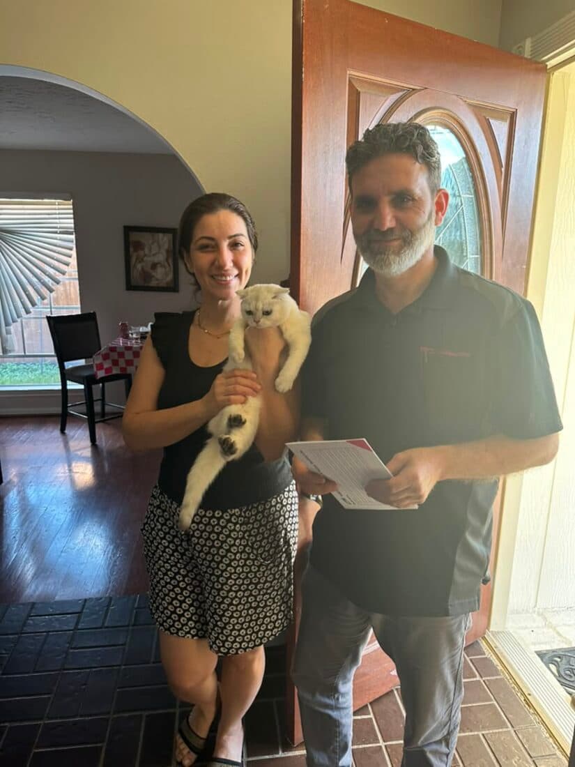 A family collecting their British Shorthair kitten from Houston Cat Mom Cattery in Houston, Texas